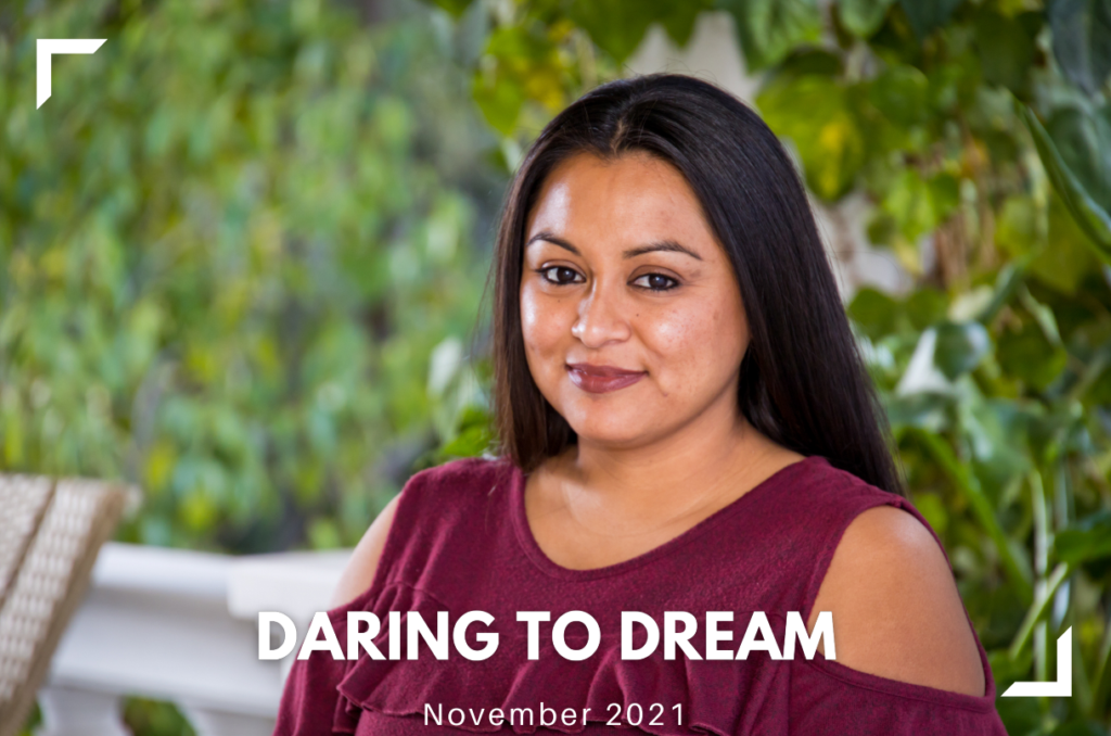 Session 84 graduate, Jackie, serenely posing for the camera, with the words Daring to Dream, November 2021, superimposed on the bottom of the photo